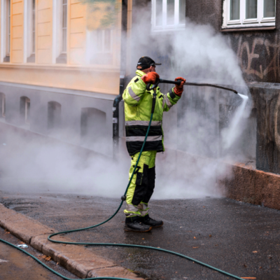 Image of graffiti removal using a professional power washing system